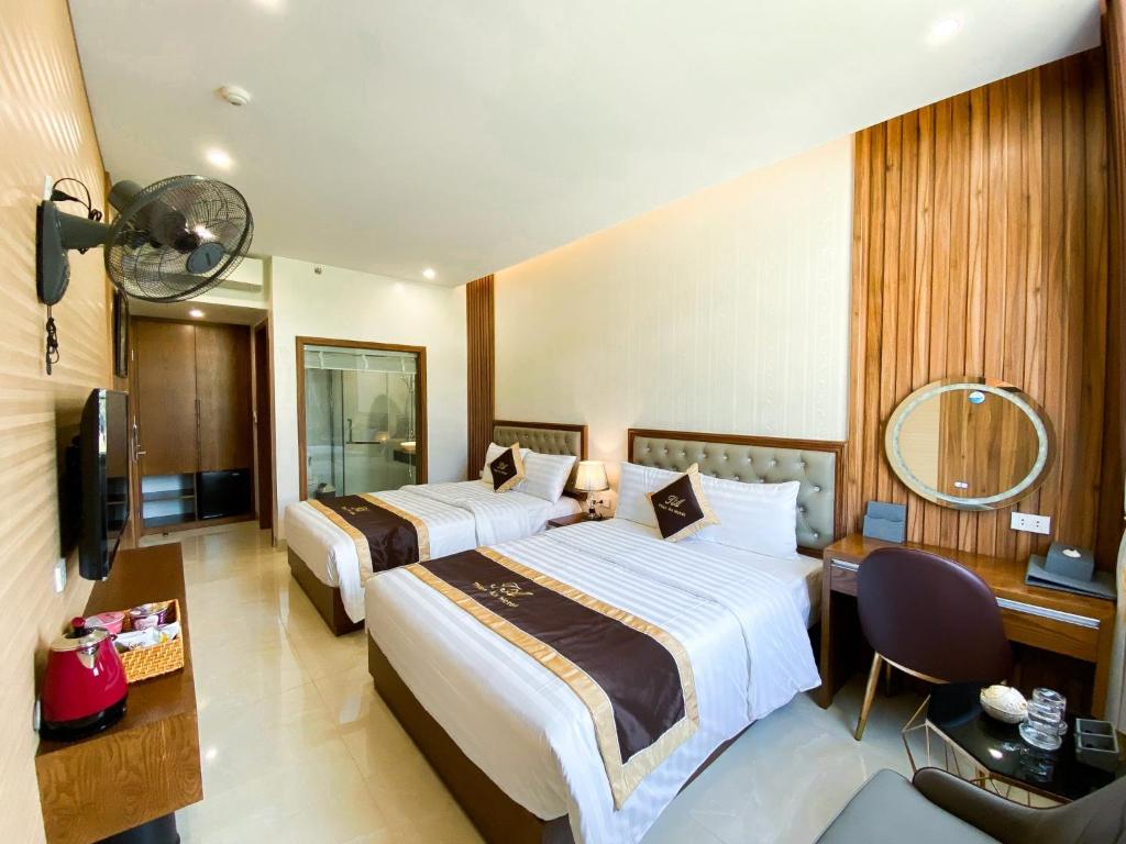 Giường trong phòng chung tại An Hotel Ha Long