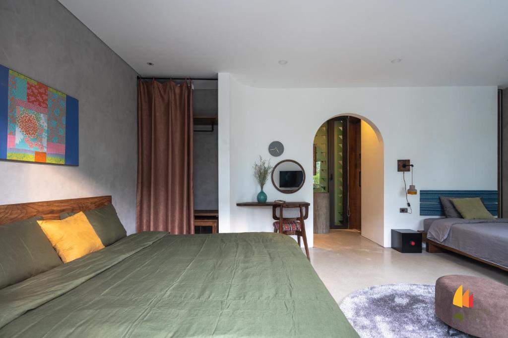 Giường trong phòng chung tại Deja Vu House Ha Long