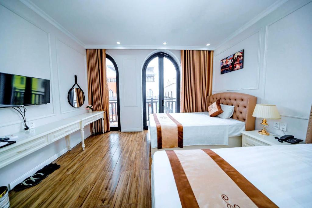 Giường trong phòng chung tại Golden Sea Hotel