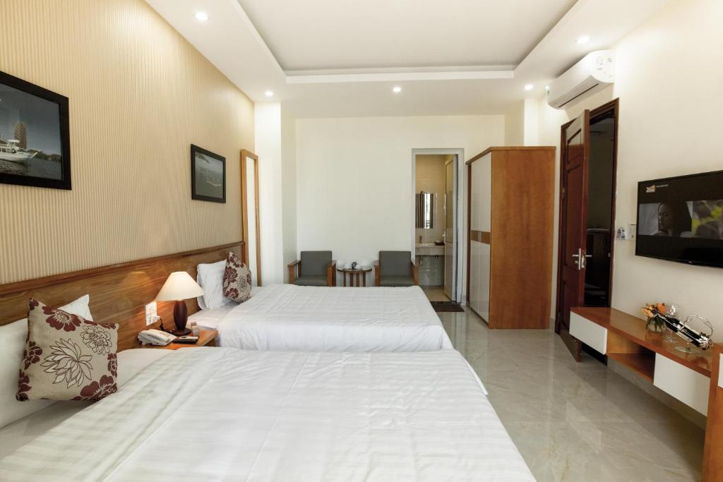 Giường trong phòng chung tại HalongSeoul Hotel