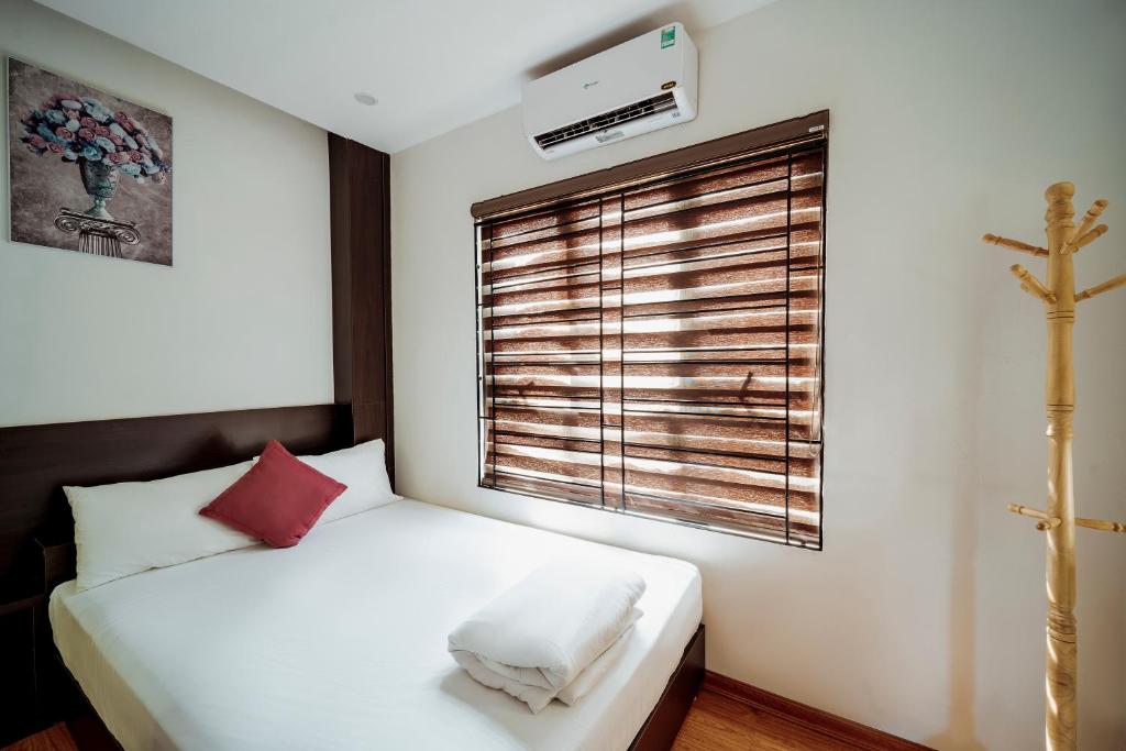 Giường trong phòng chung tại Ivy Hotel