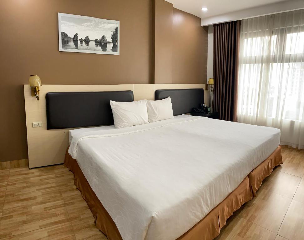 Giường trong phòng chung tại Bảo Hân 2 Hotel