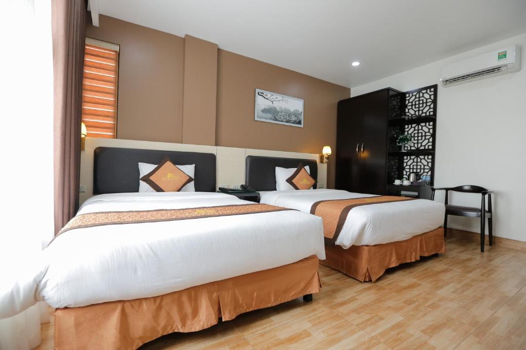 Giường trong phòng chung tại Bảo Hân 2 Hotel