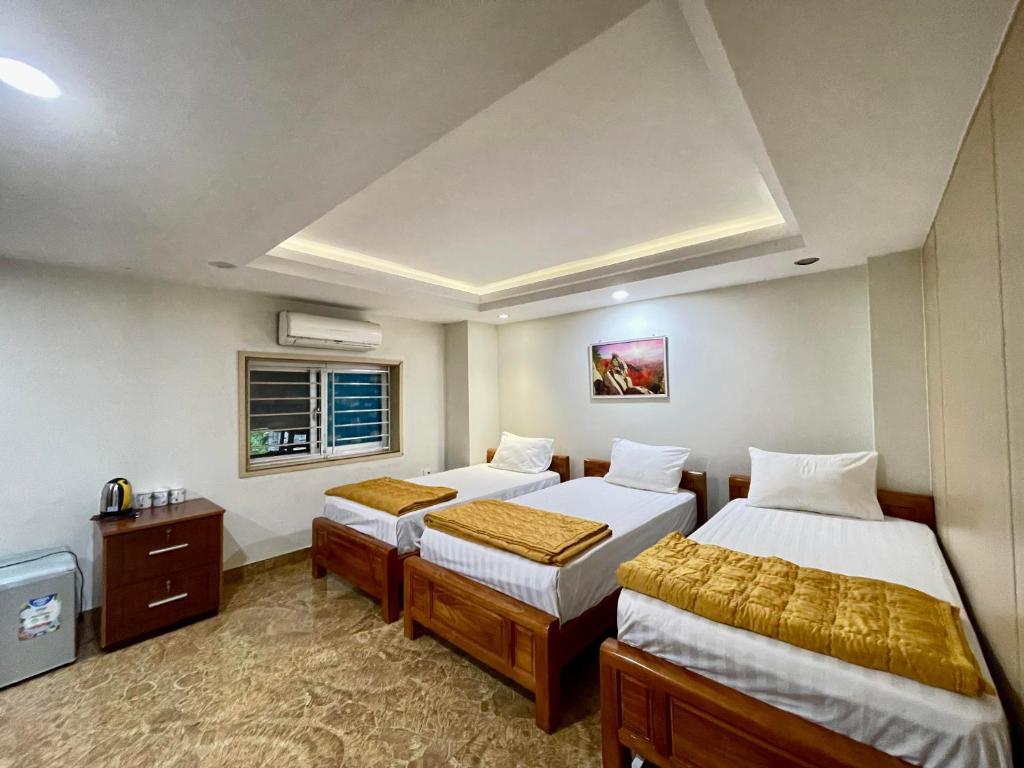 Giường trong phòng chung tại Minh Đức Green Hotel Tuần Châu