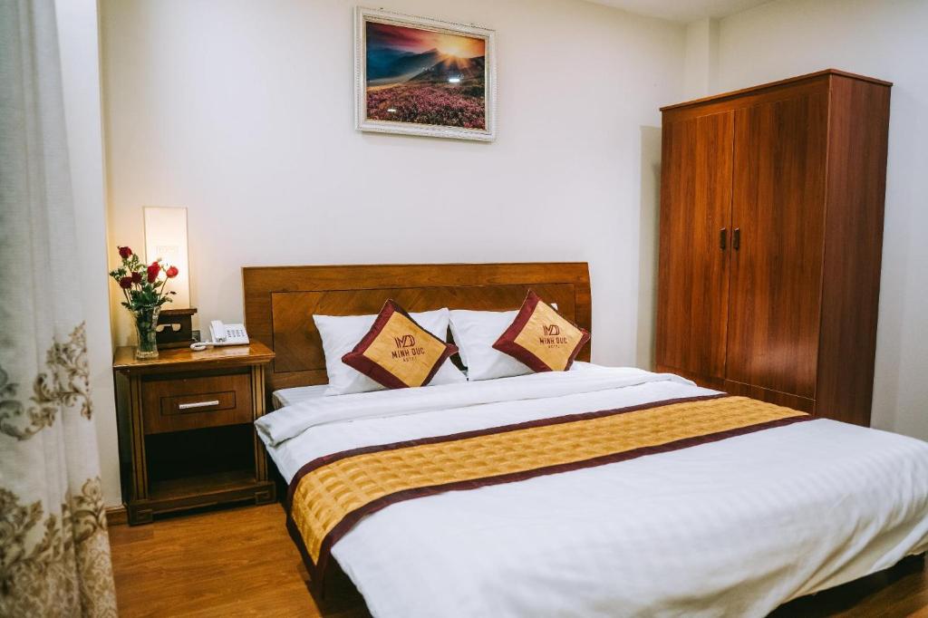 Giường trong phòng chung tại Minh Đức Green Hotel Tuần Châu