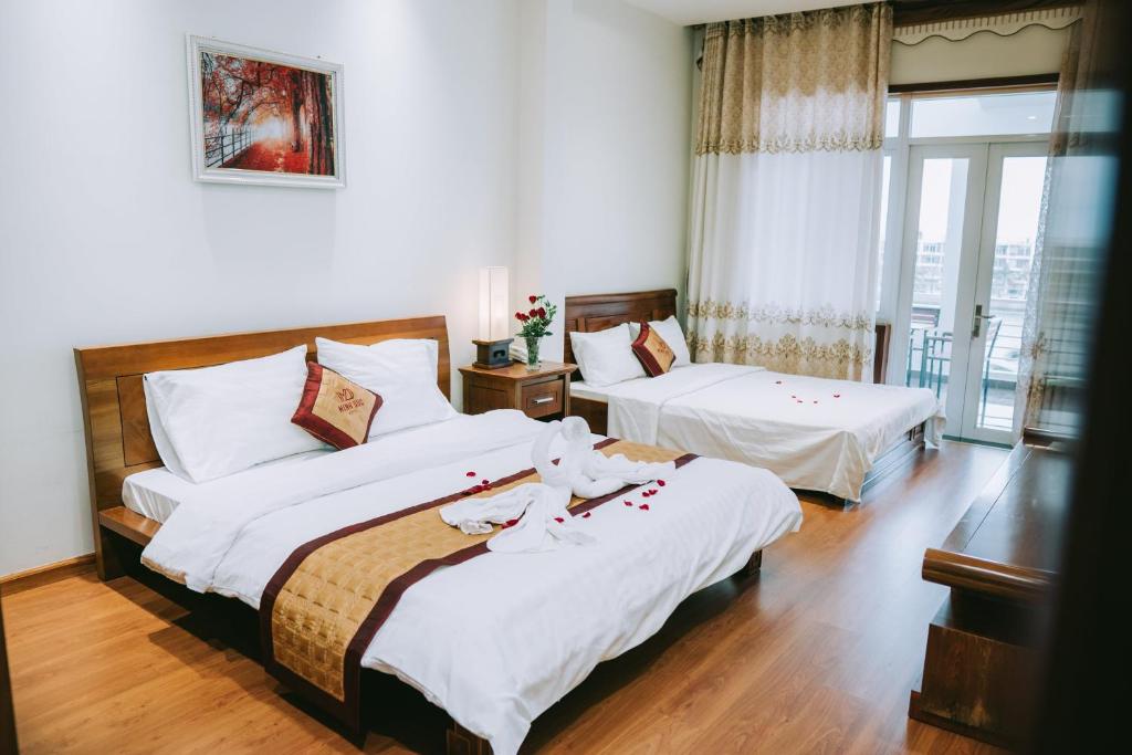 Giường trong phòng chung tại Minh Đức Green Hotel Tuần Châu