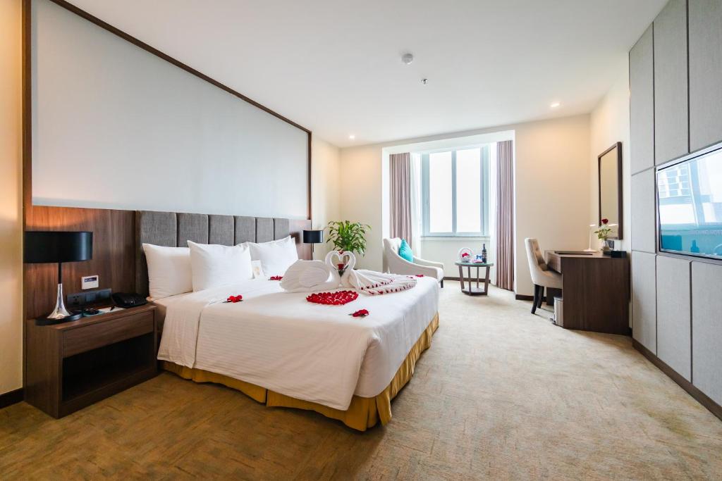 Giường trong phòng chung tại Mường Thanh Holiday Suối Mơ Hạ Long