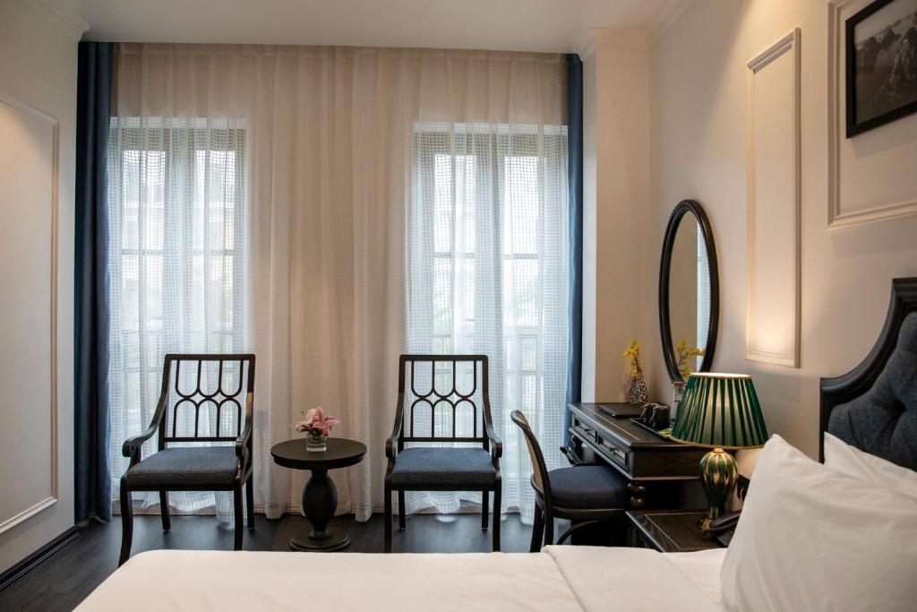 Giường trong phòng chung tại Ha Long Essence Hotel