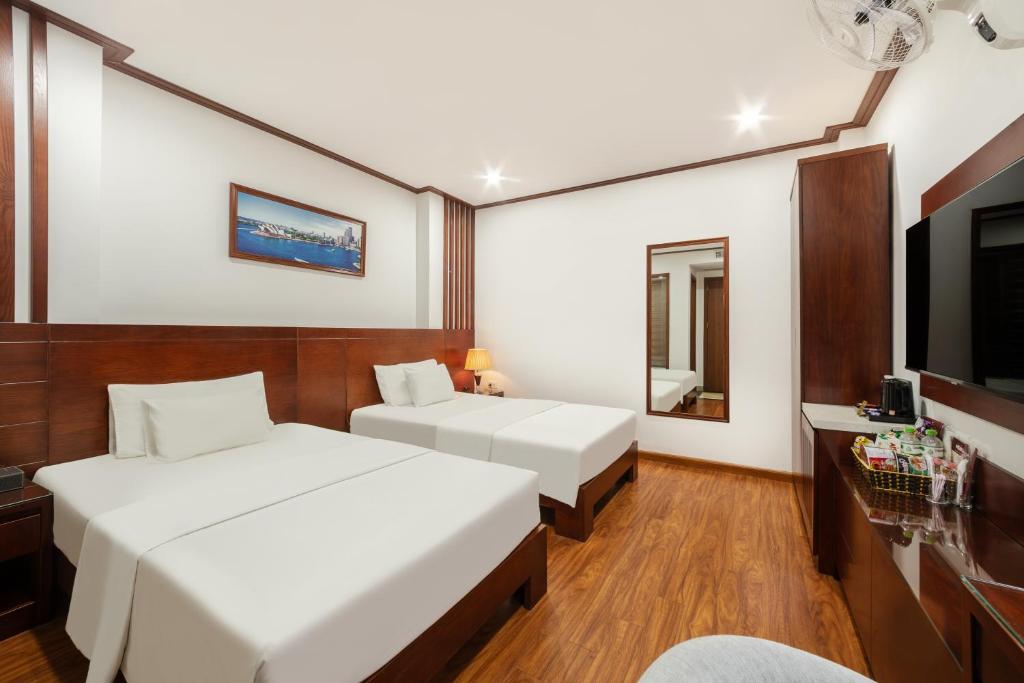 Giường trong phòng chung tại A25 Hotel - Bãi Cháy Hạ Long