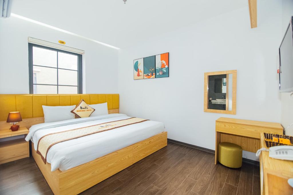 Giường trong phòng chung tại Maruko Hạ Long Hotel