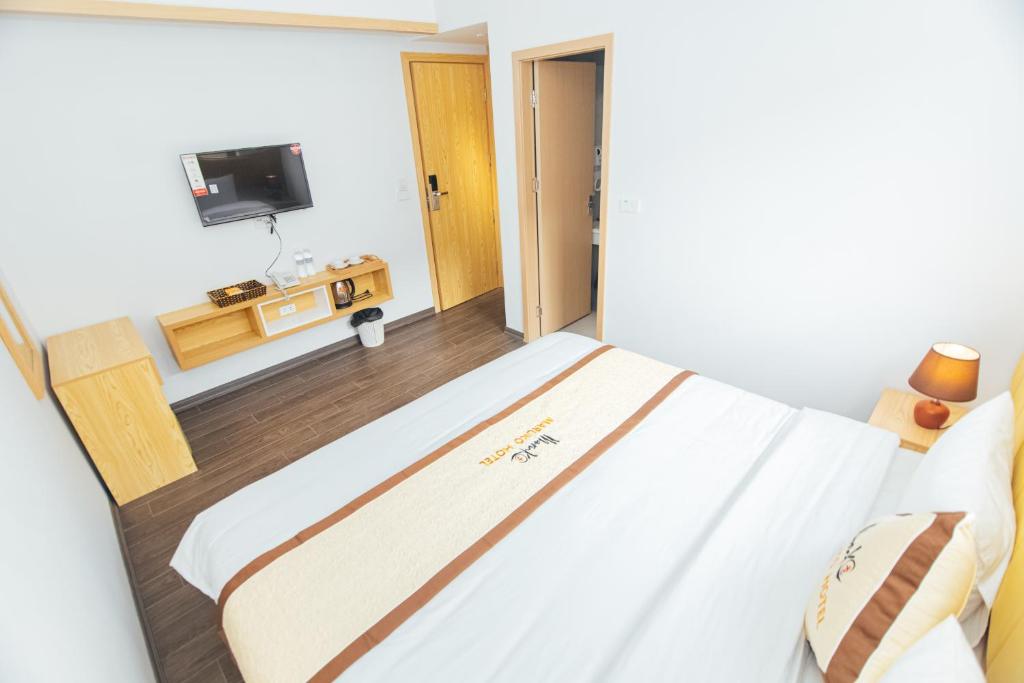 Giường trong phòng chung tại Maruko Hạ Long Hotel