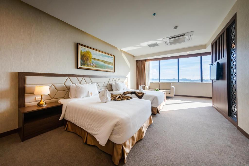 Giường trong phòng chung tại Muong Thanh Grand Ha Long Hotel