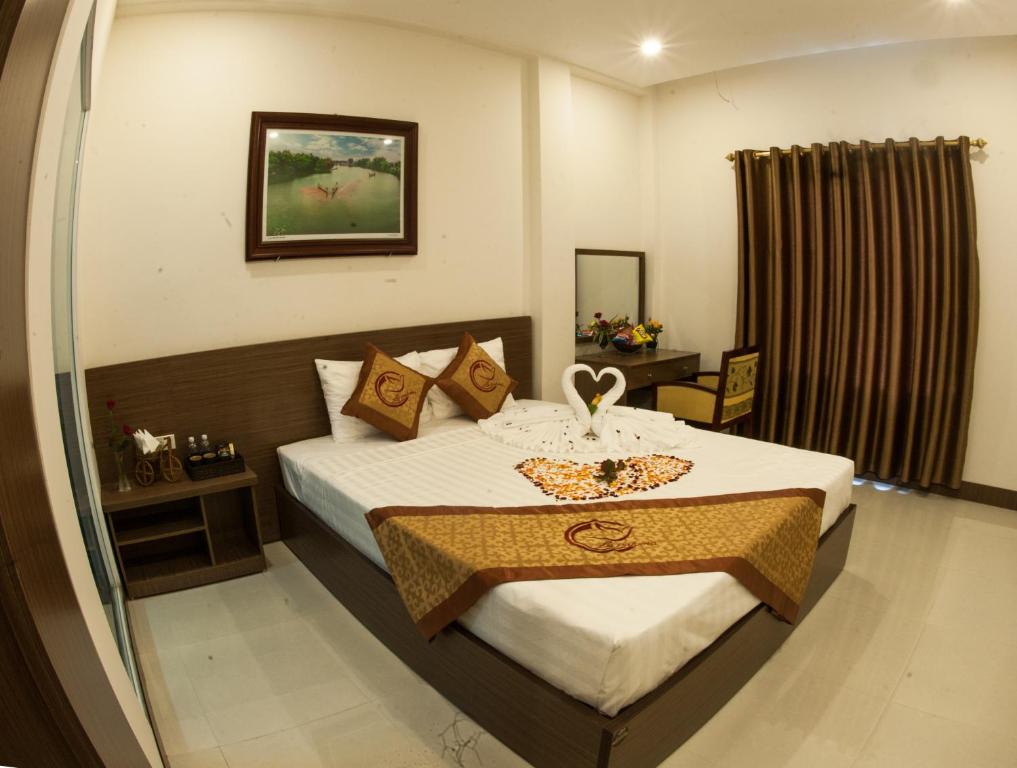 Giường trong phòng chung tại La Paloma Hotel Ninh Binh