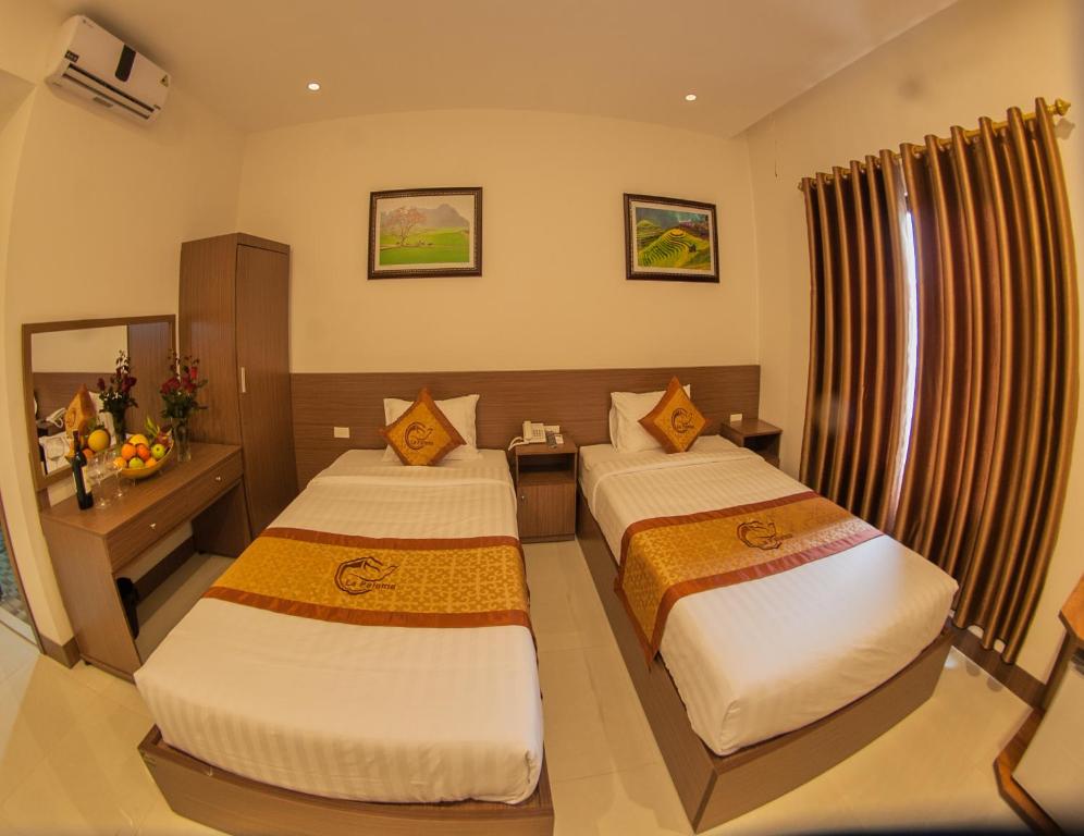 Giường trong phòng chung tại La Paloma Hotel Ninh Binh