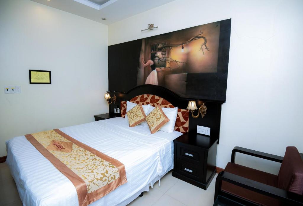 Giường trong phòng chung tại Starlight hotel Bãi Cháy