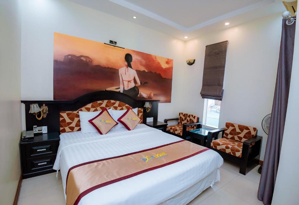 Giường trong phòng chung tại Starlight hotel Bãi Cháy
