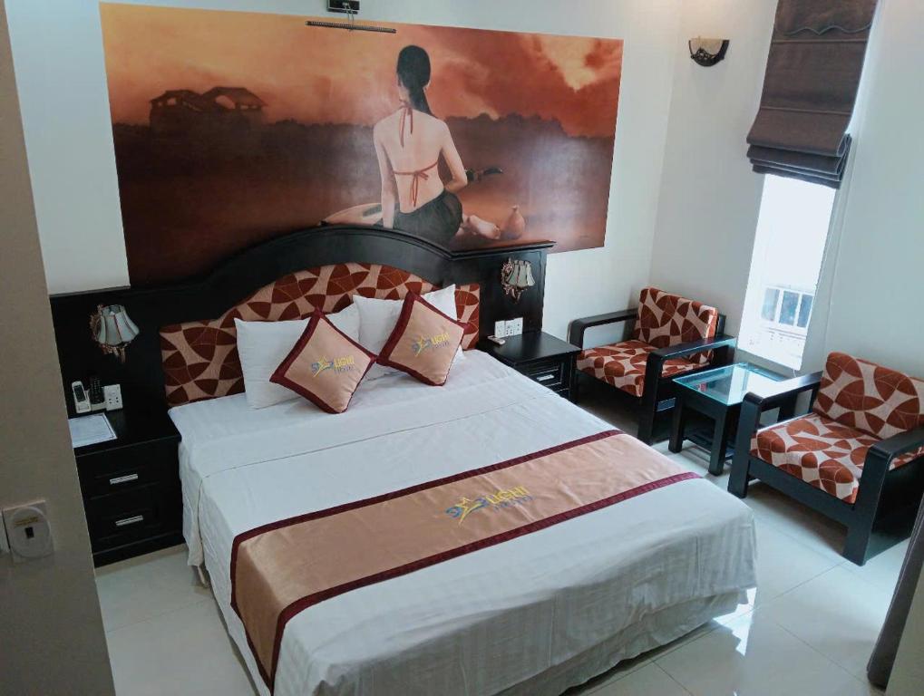 Giường trong phòng chung tại Starlight hotel Bãi Cháy