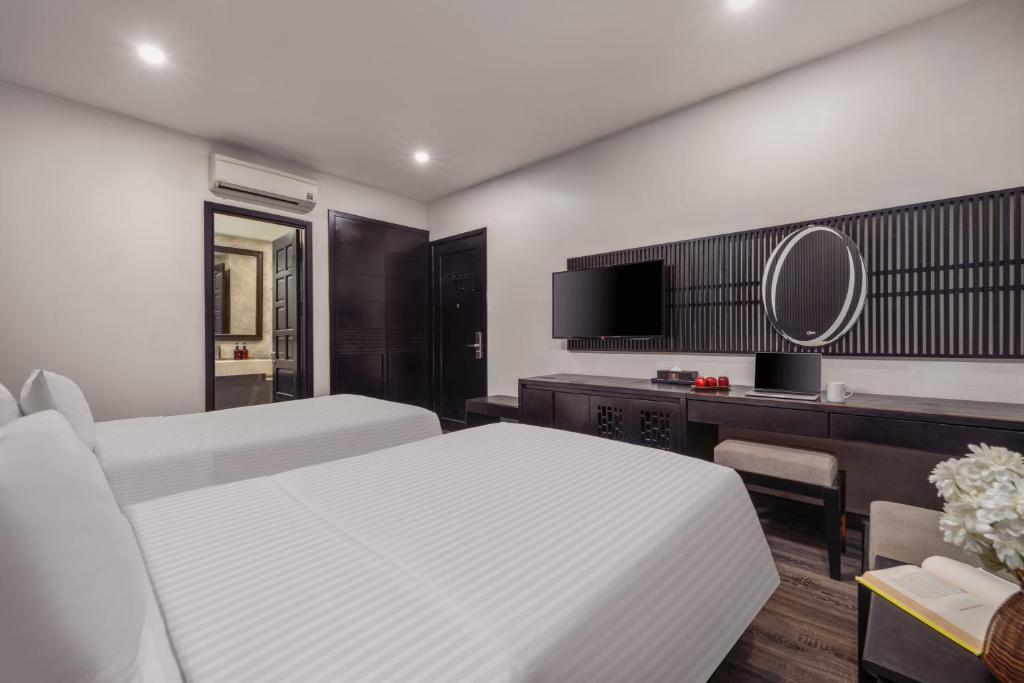 Giường trong phòng chung tại Ocean Star Da Nang Bay Hotel