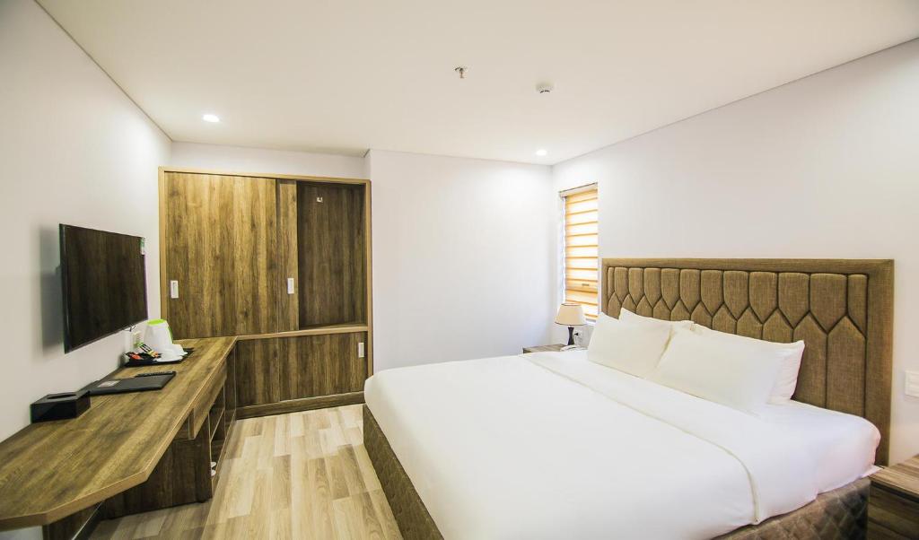 Giường trong phòng chung tại Sea Light Hotel Da Nang